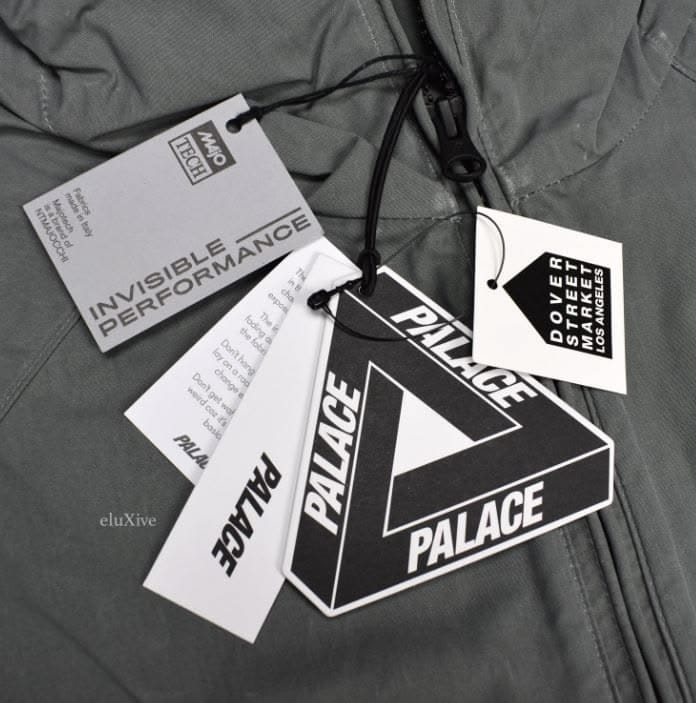 Black and white fashion hang tags attached to a jacket